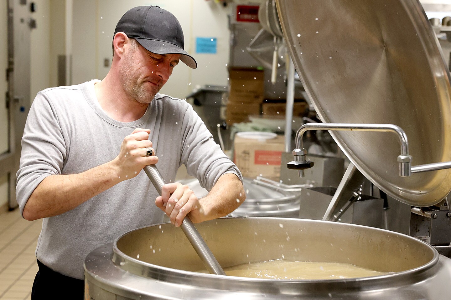 Man stirs gravy.