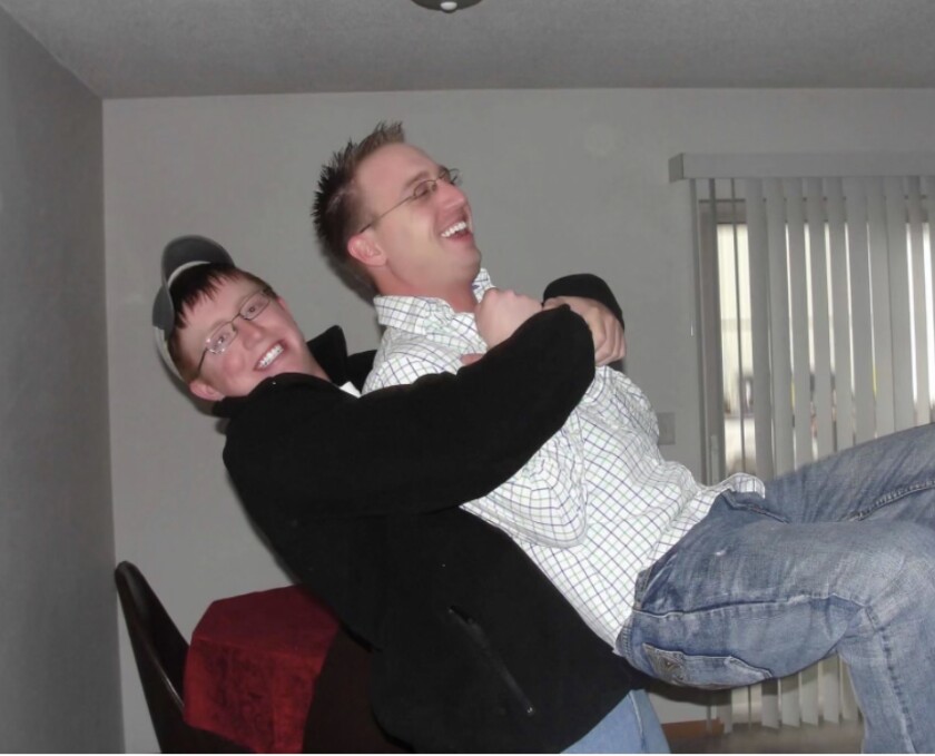 Two brothers, laughing and horsing around