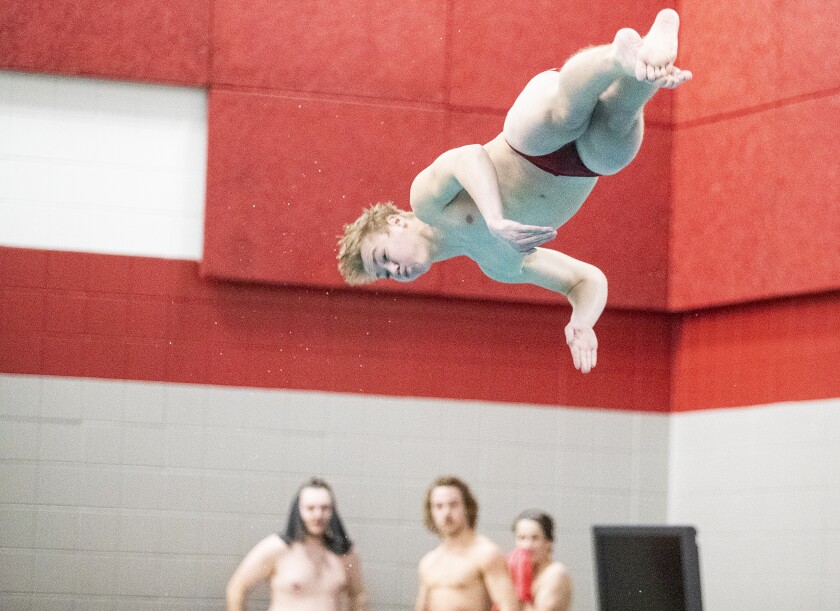 Willmar junior Kale Bockelman performs a dive as the Cardinals hosted Sartell on Thursday, Feb. 3, 2022