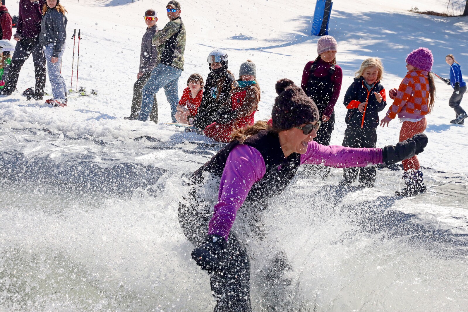 Skiers and snowboarders participate in the water skip at Mount Ski Gull on Saturday, April 8, 2023, for the end of the season.