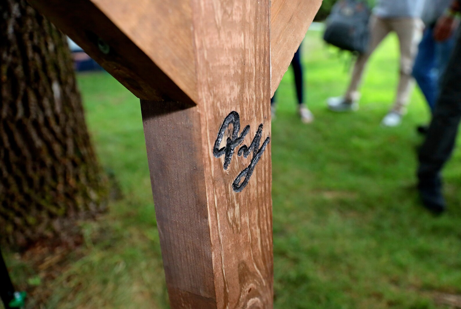 Ty's signature engraved in post.