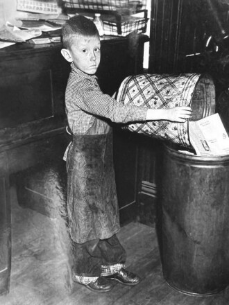 A child working at a newspaper office.