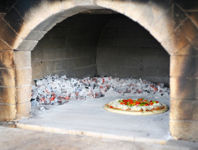 Pizza baking in oven