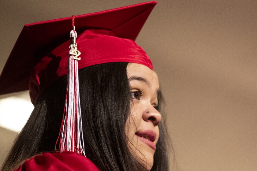 A tear rolls down the cheek of student speaker Amelia Fernandez talks about her difficult road to graduation during the Area Learning Center's senior graduation ceremony on Thursday, May 19, 2022, at the Willmar Education & Arts Center.