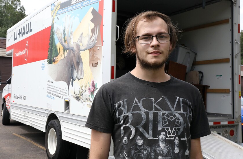 Zach Stirewalt, formerly of Cloquet, takes a break from moving his mother-in-law to an apartment in Duluth on Tuesday afternoon