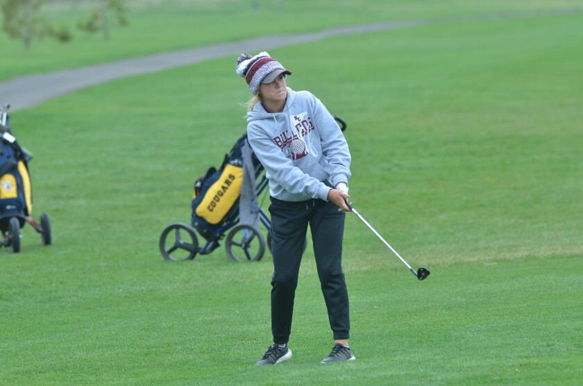 Bowman County junior Brooke Peterson chips a shot onto the 13th green of the Pheasant Country Golf Course during the East-West Classic on Saturday, May 12th. (Patrick Bernadeau/The Dickinson Press)