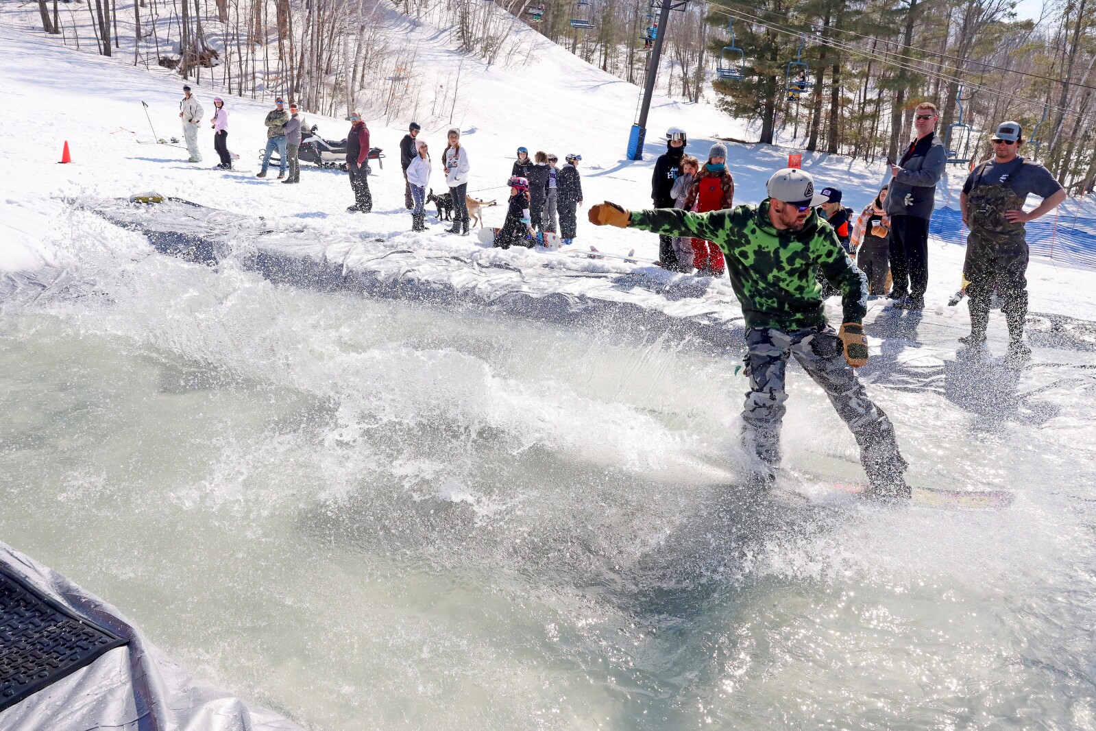 Skiers and snowboarders participate in the water skip at Mount Ski Gull on Saturday, April 8, 2023, for the end of the season.