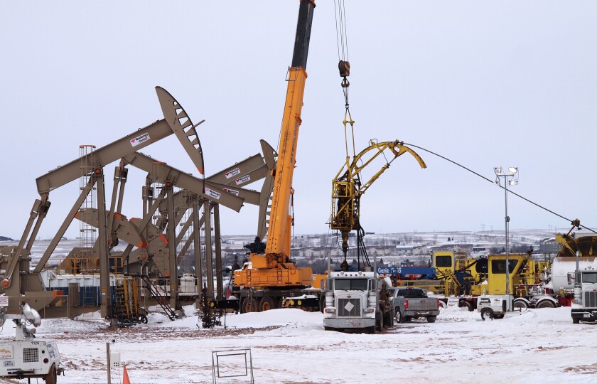 Crews work at an oil well site in Williston, N.D., on Wednesday, March 8, 2017. Amy Dalrymple/Forum News Service