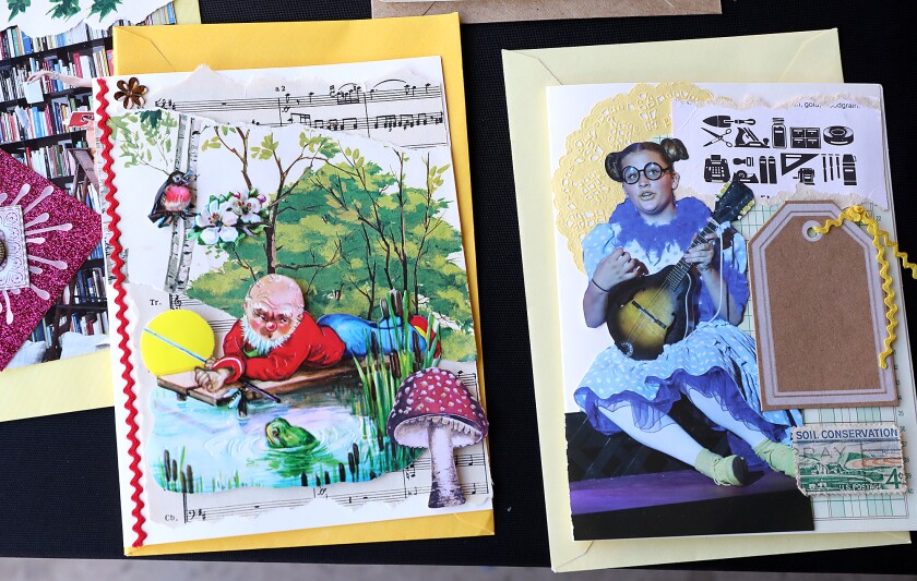 Whimsical cards made by Deb Wilson rest on a table in her garage in Superior