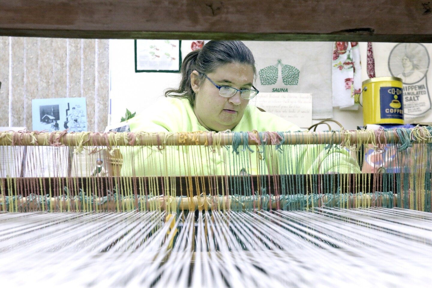 Alana Maijala demonstrates weaving on a two-harness loom in the museum in the Loon Lake Community Center during Laskiainen on Sunday. Maijala said she was raised in “Minnesota’s Finnish Twin Cities” of Palo-Markham. Steve Kuchera / skuchera@duluthnews.com