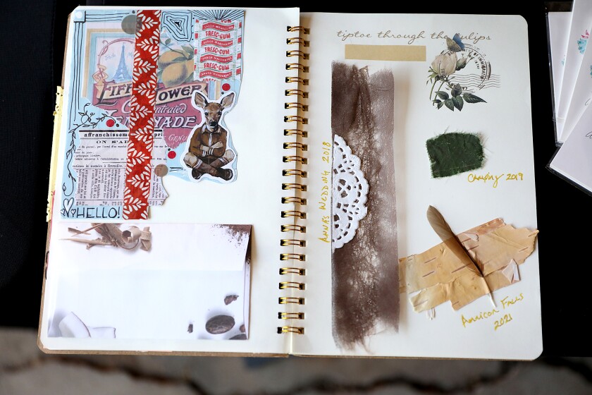 One of Deb Wilson’s Junk Journals sits open on a table