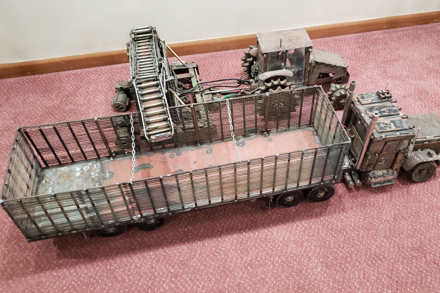A tractor, lifter and semi-trailer appear ready to haul sugar beets from the field. This is among the works by Pat Amberg on display at the Bird Island Cultural Centre.