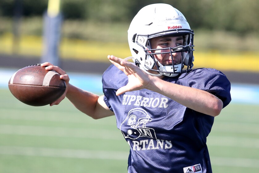 Superior quarterback Hayden Smith throws a pass