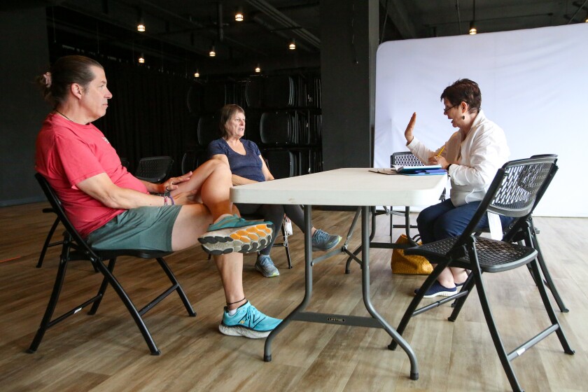 Actors Jeffrey Rondeau and Patti McGuire listen to some feedback from director Toni Gredensky on Monday, Sept. 8, 2025, at Stage West in West Fargo during rehearsal for the play "The Guys."