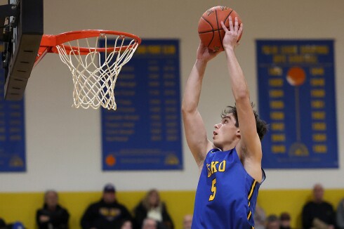 Player dunks ball.