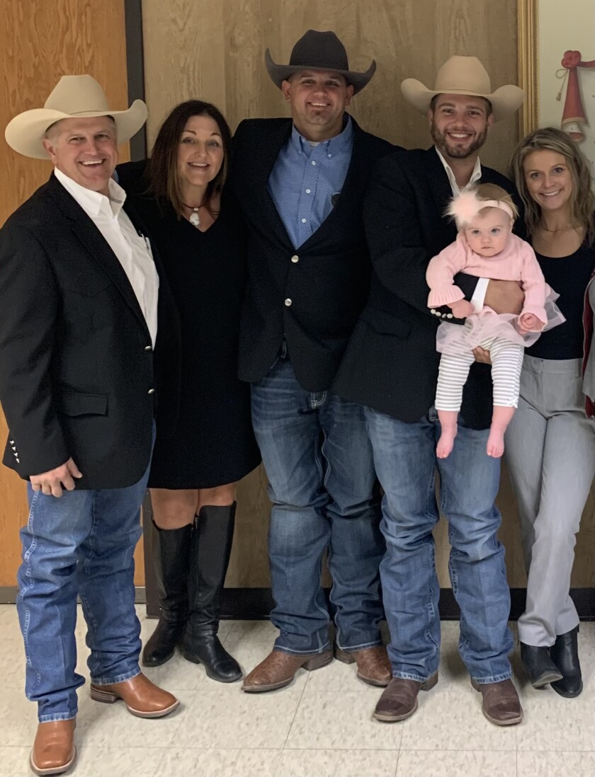 Wayne Herman, left, and his family are pictured.