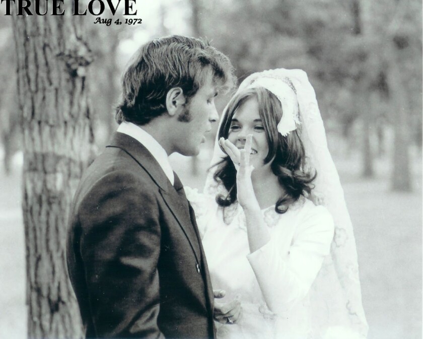 A young bride feeds cake to her groom
