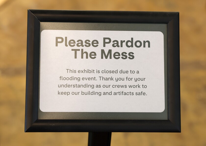 Sign explaining mess.