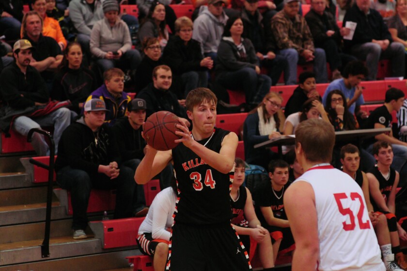 Killdeer guard/forward Alex Sadowsky looks for the open man in action against Dickinson Trinity during the Roughrider Tournament on Dec. 13, 2016. (Press File Photo)
