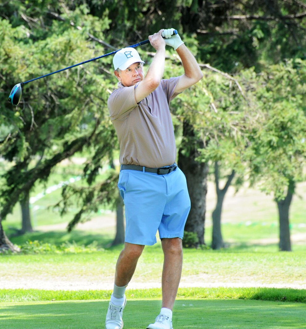 Tom Ryan watches his drive land in play on the No. 6 hole on Aug