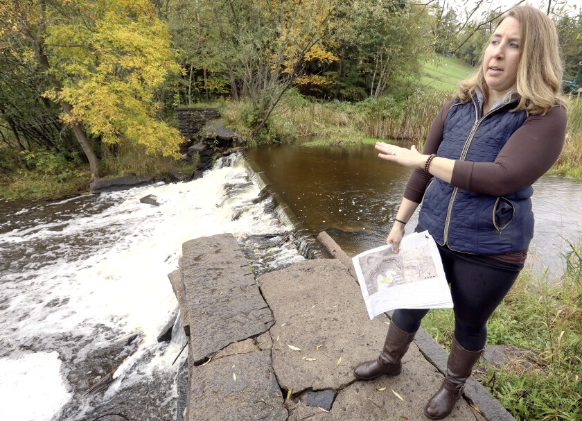 Woman talks by Chester Creek.