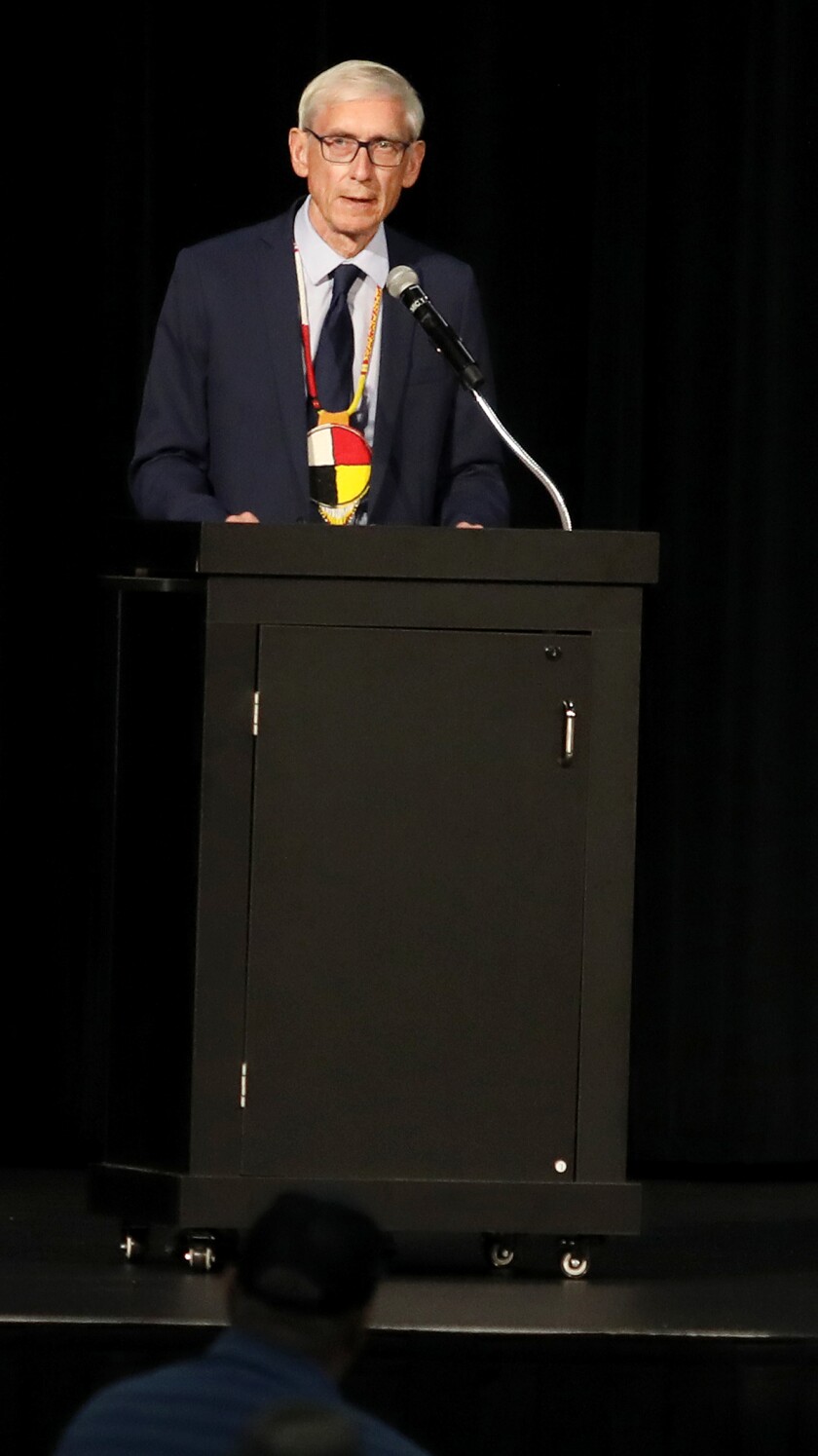 Wisconsin Gov. Tony Evers thanks a number of people for their hard work as he speaks during the Reclamation Ceremony