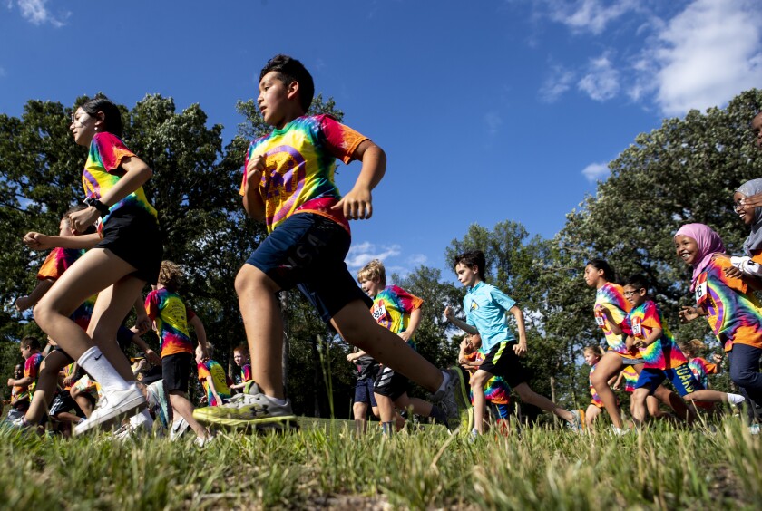 Children compete in the Miles 4 Mentors run during the first Rockin' Robbins event of the summer season at Robbins Island Regional Park in Willmar on Tuesday, July 12, 2022.