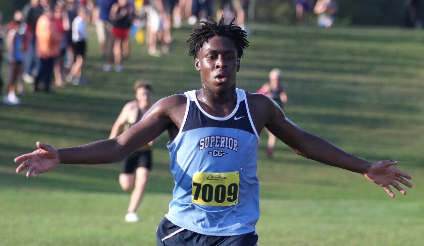 Superior’s Kanayo Onwudiegwu (7009) spreads his arms as he finishes in ten place