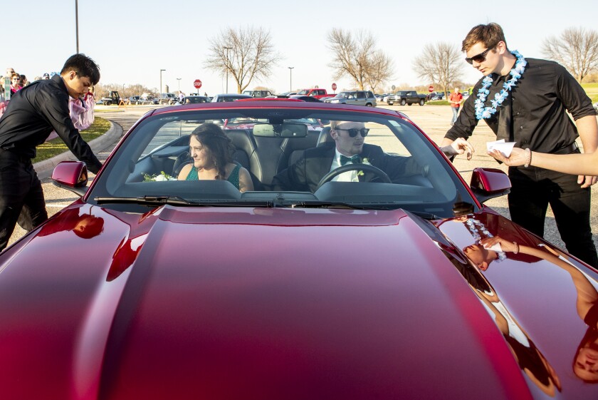 Willmar High School prom attendees depart their car during grand march on Friday, May 6, 2022.