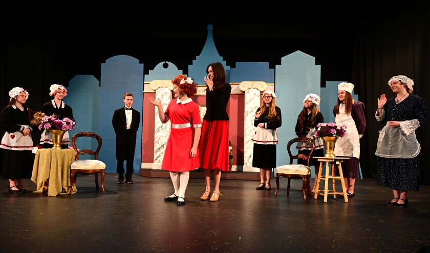 The cast of Stage North Theatre Co.'s production of "Annie JR." rehearses a scene in costume Tuesday, Nov. 22, 2022, at the Franklin Arts Center in Brainerd.