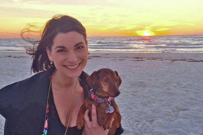 Late Tuesday, June 14, Aviv 613 Vodka posted on Facebook this undated photo of Samantha Edwards with her pet dachshund.