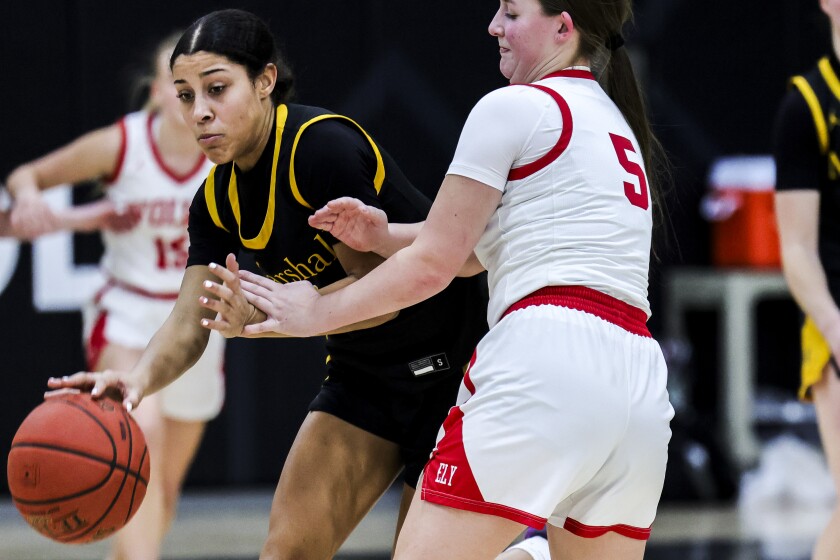 high school girls play basketball