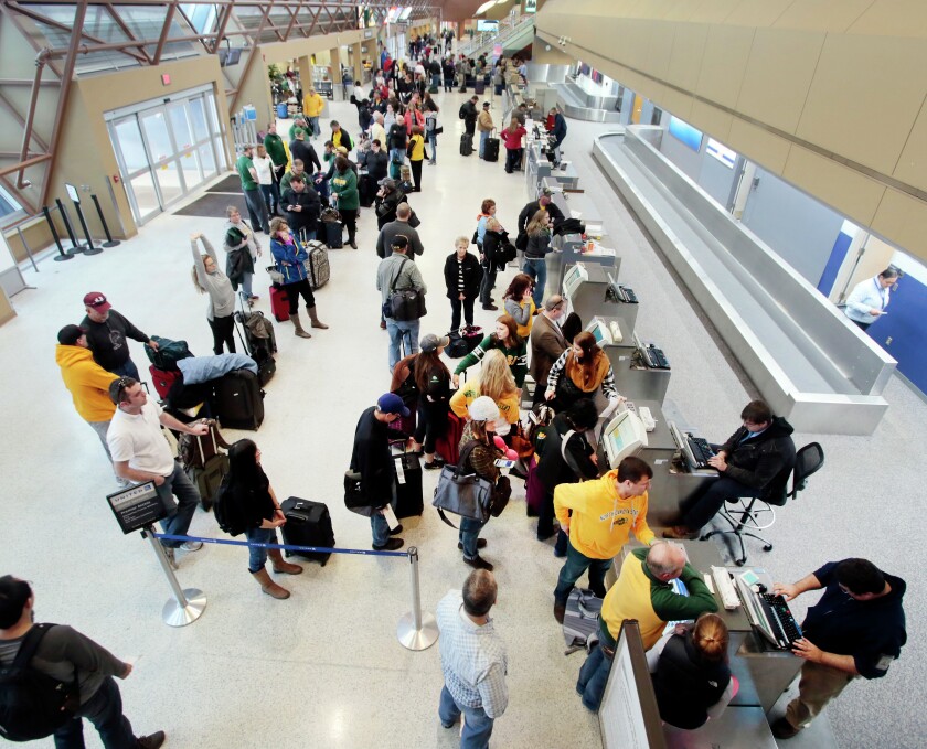 Passengers try to line up flights out of Fargo's Hector International Airport on Thursday, Jan. 7, 2016. Forum file photo