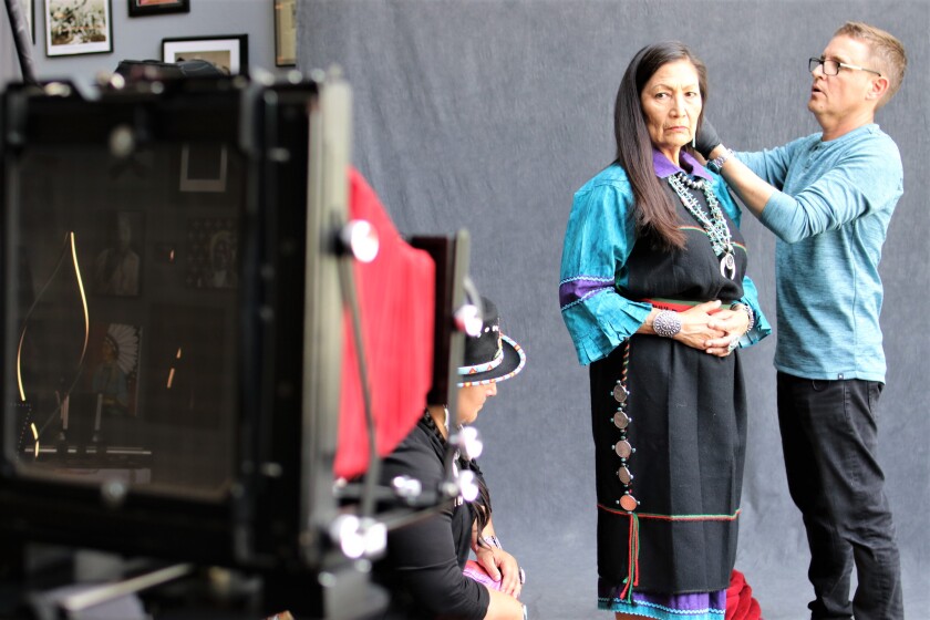 Shane Balkowitsch preparing New Mexico's Representative Debra Haaland for her wet plate photograph in 2019. .jpeg