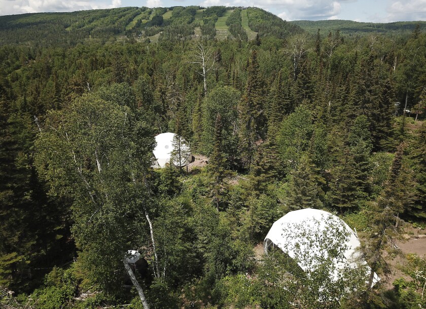 Aerial view of wooded property.