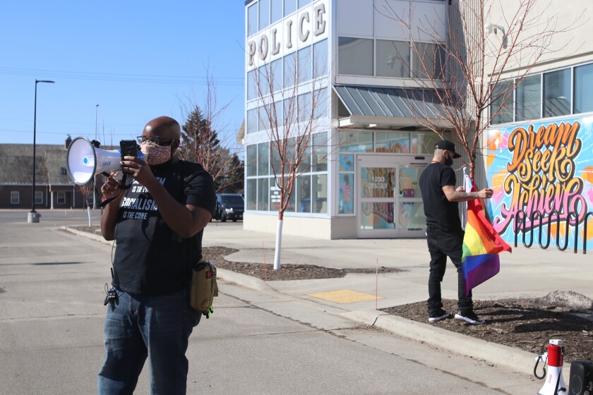 Jamaal Abegaz, an activist formerly involved with Black Lives Matter, is now a coordinator with the African People's Socialist Party. Here he is speaking before protesters during the Justice for George Floyd Solid.jpg