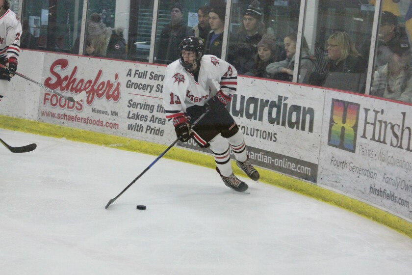 Northern Lakes forward Nate Finnerty controls the puck in the third period of the Lightning's game against Little Falls on Tuesday, Dec. 19.