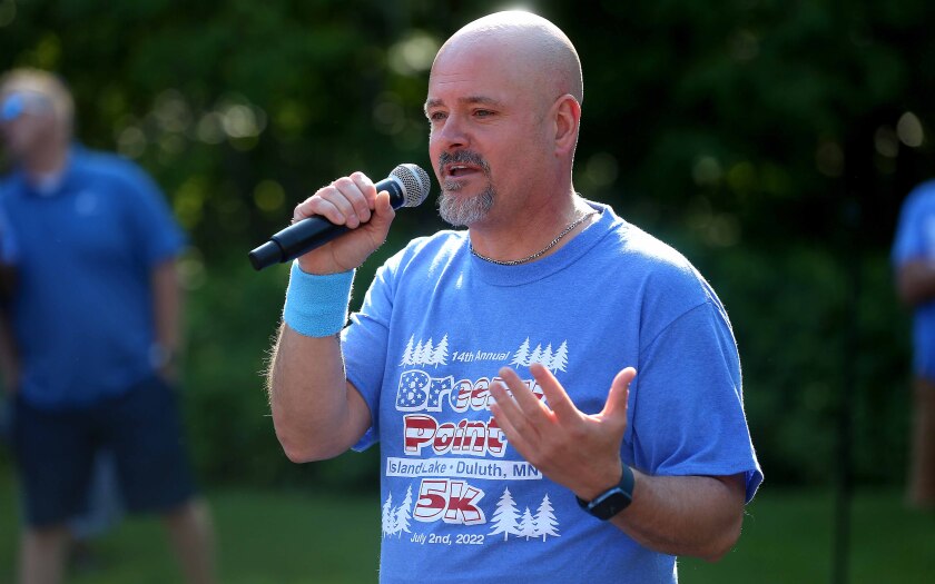 Man speaks into a microphone