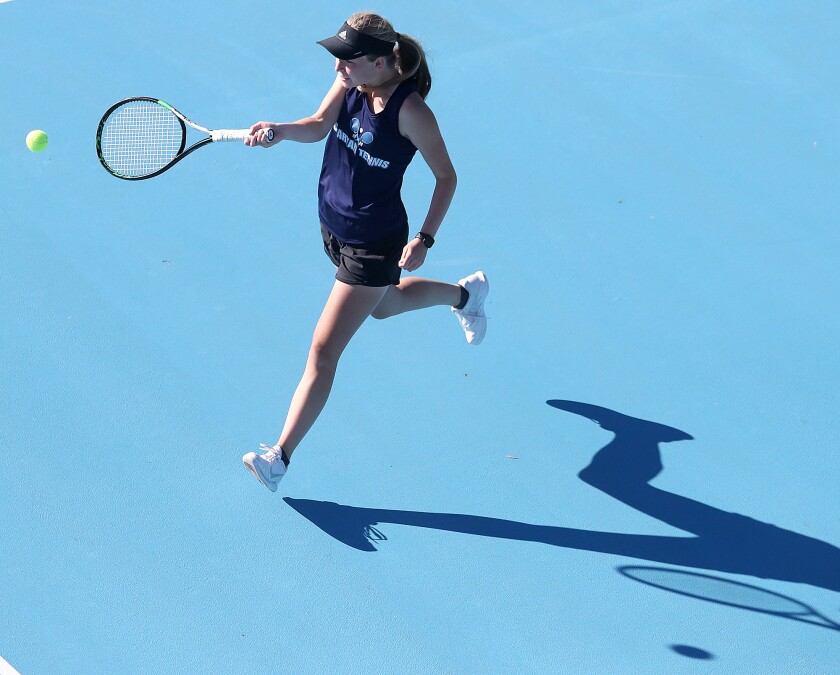 Superior’s Gretta Clark chases down the ball during her match at no.1 doubles