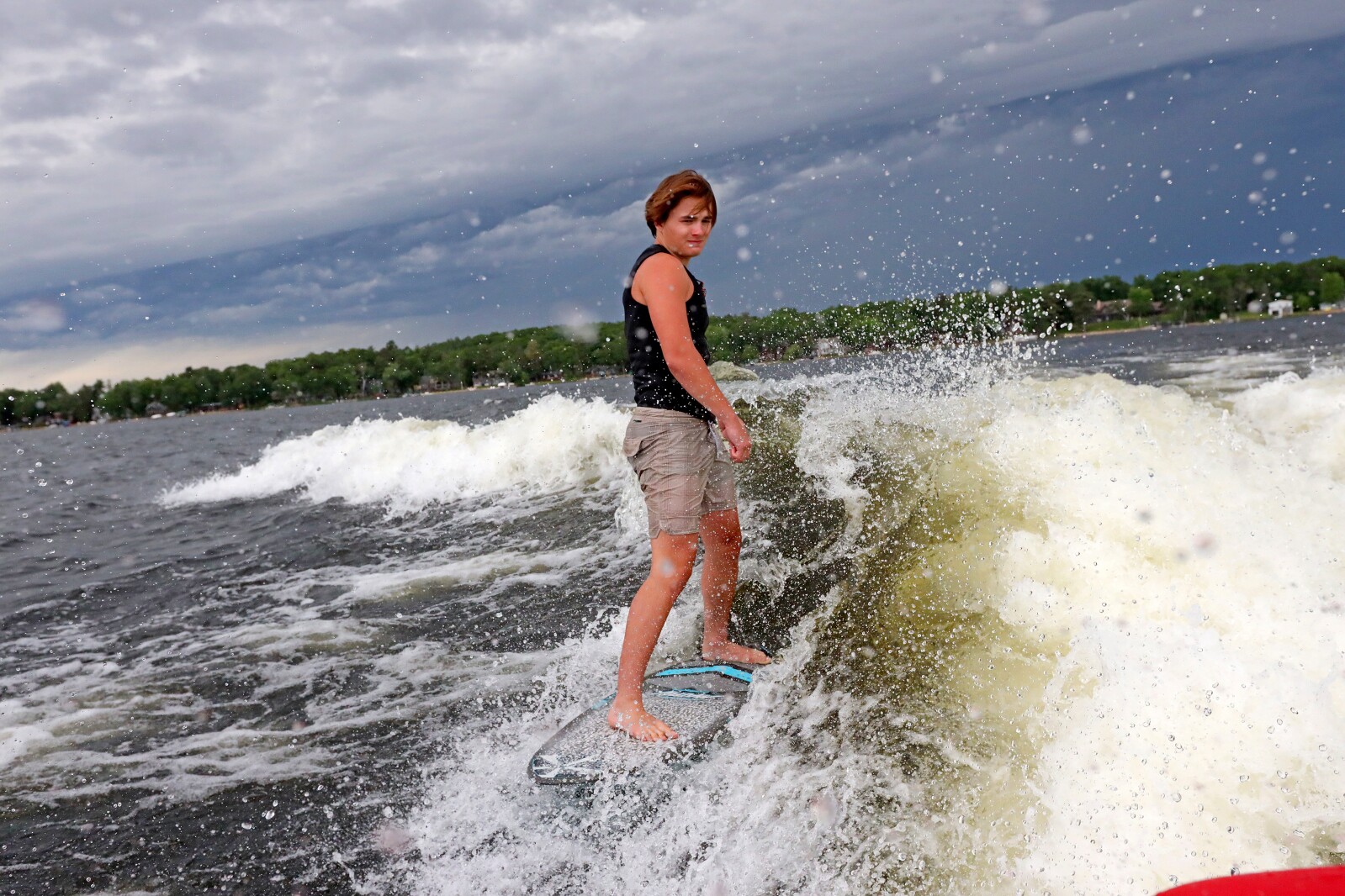 Parker Linn demonstrates wake surfing for people during the ninth annual Bar Harbor In-Water Boat Show on Saturday, June 18, 2022, on Gull Lake. Watercraft for the boat show were brought by Nisswa Marine and Minnesota Inboard Water Sports and a Wake Responsibly event taught attendees boat safety and responsibility.