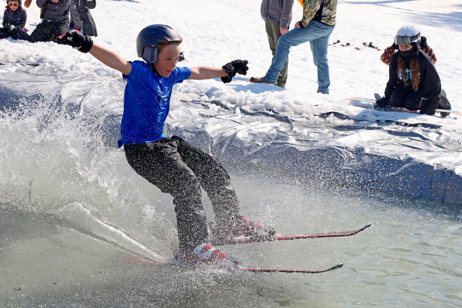 Skiers and snowboarders participate in the water skip at Mount Ski Gull on Saturday, April 8, 2023, for the end of the season.