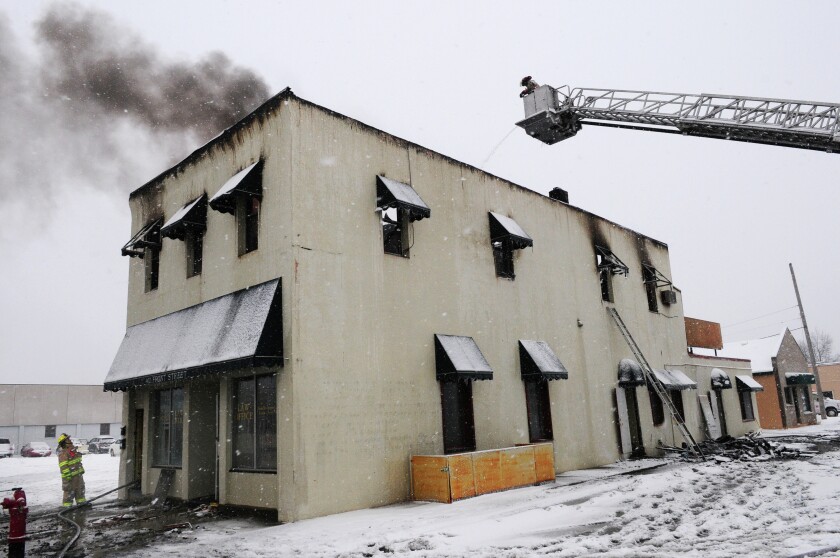 Fire still smolders Tuesday morning at 402 Front Street in Brainerd after fire swept through the building taking a life of a tenant and his dog. The building houses a law office with apartment units upstairs. One of the tenants escaped. Brainerd Dispatch/Steve Kohls