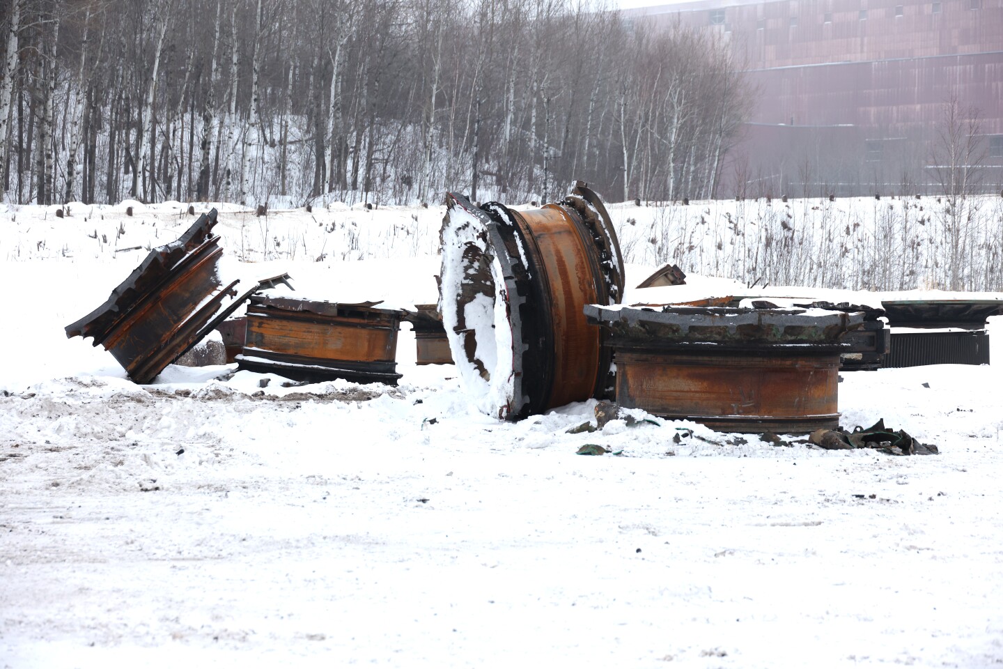 Scrap metal from grinding mills lay in salvage yard