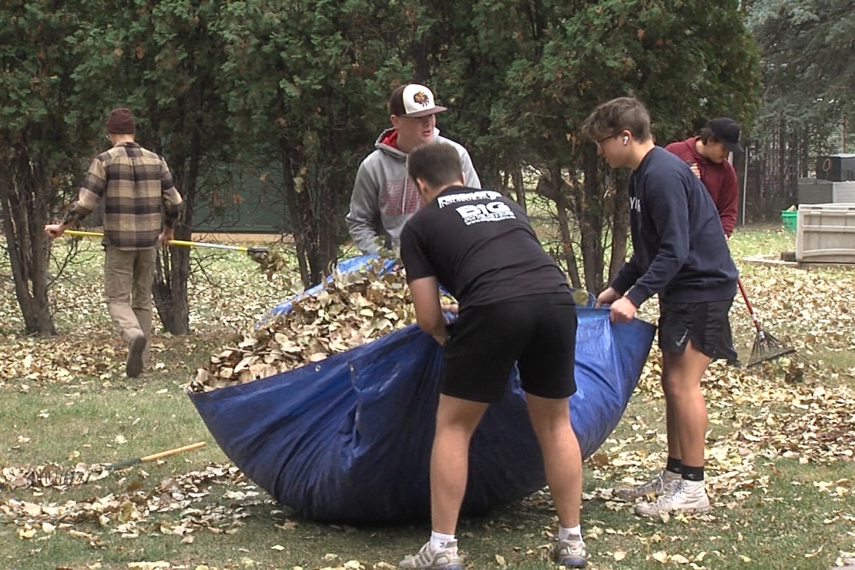 Fargo South athletes roll up sleeves, get hands dirty for 'rent an