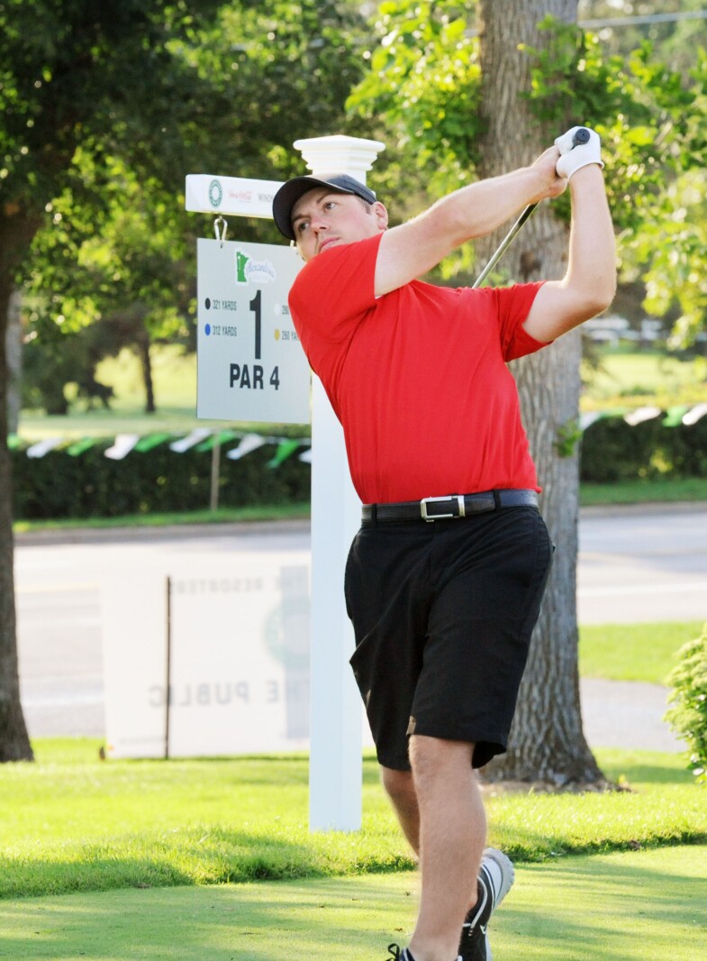 Cory Pelzel watches from the No. 1 tee box to see where his driv
