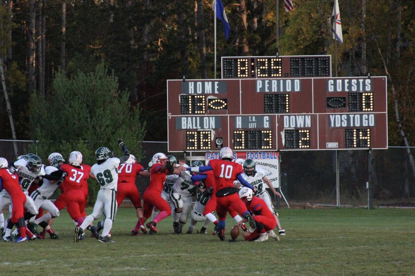 Pequot Lakes' CJ Borleis prepares to kick an extra point after the Patriots' second touchdown in the opening minutes against Roseau in the Section 8AAA quarterfinals on Tuesday, Oct. 13. The Rams did block the kick. Photo by Pete Mohs