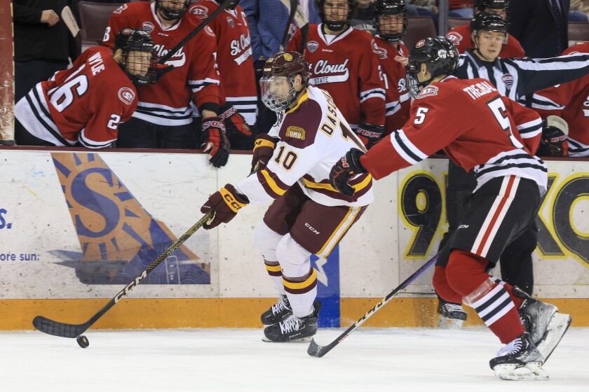 college men play ice hockey