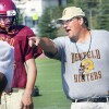 Huie gives pointers to his players