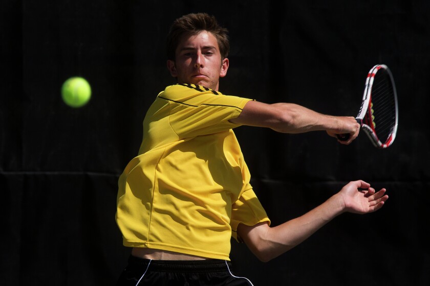 Mitchell High School's Alex Hegg returns the ball while playing against Jesse Margolies of Aberdeen Central High School during Friday's state tennis third round match at Sioux Park in Rapid City. (Josh Morgan/Rapid City Journal)