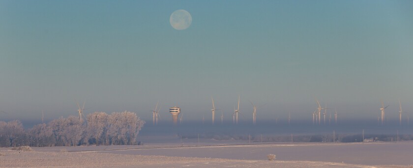 Rime ice forms frost on the trees west of Worthington as the Lincoln-Pipestone Rural Water tower pokes out of the fog on a recent Saturday morning. This photo was taken from Monroe Avenue as the moon set.